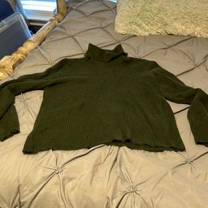 Green turtleneck sweater.